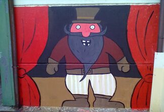 Foto di murales a colori raffigurante Barbanera su edificio scolastico